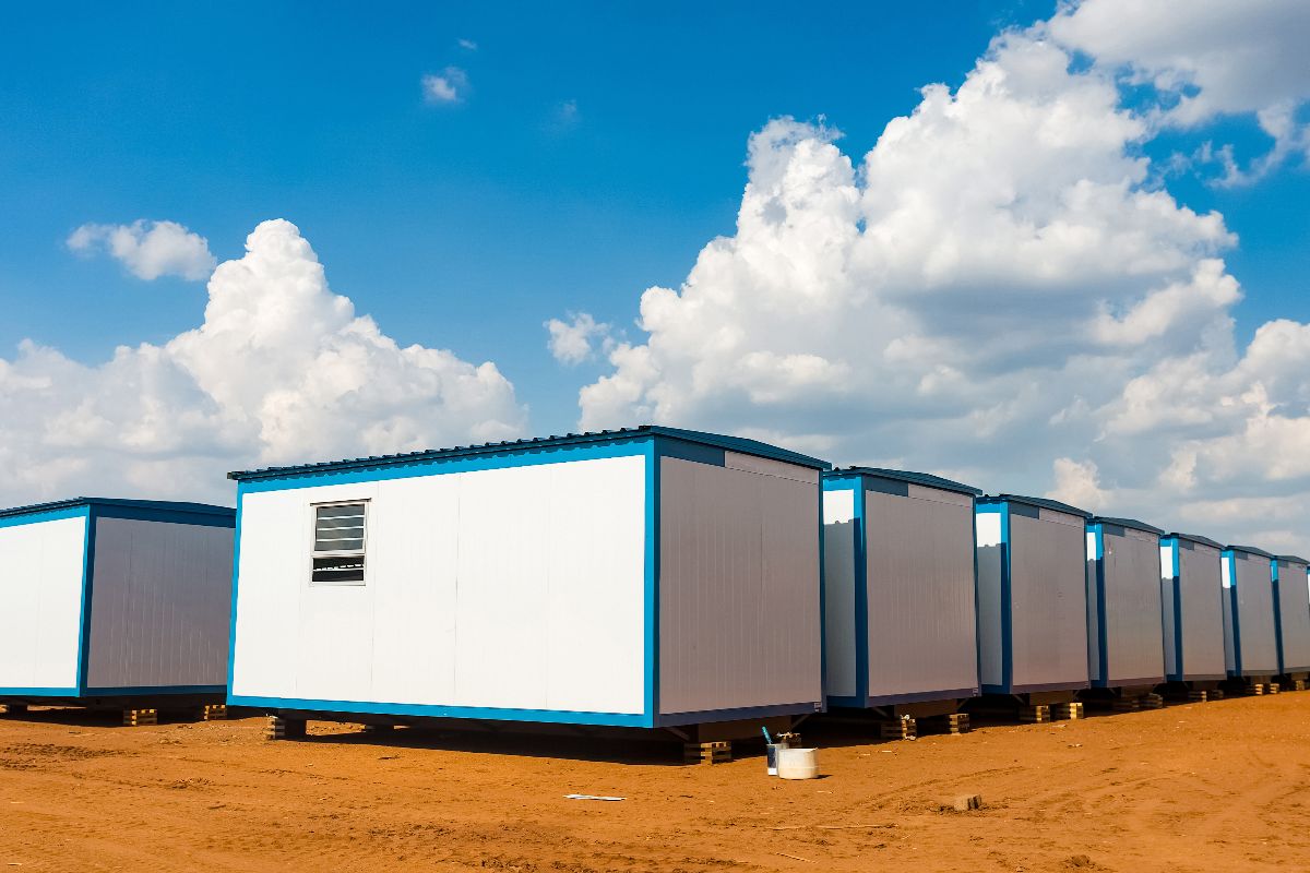 Modular temporary site offices lined up on a construction site