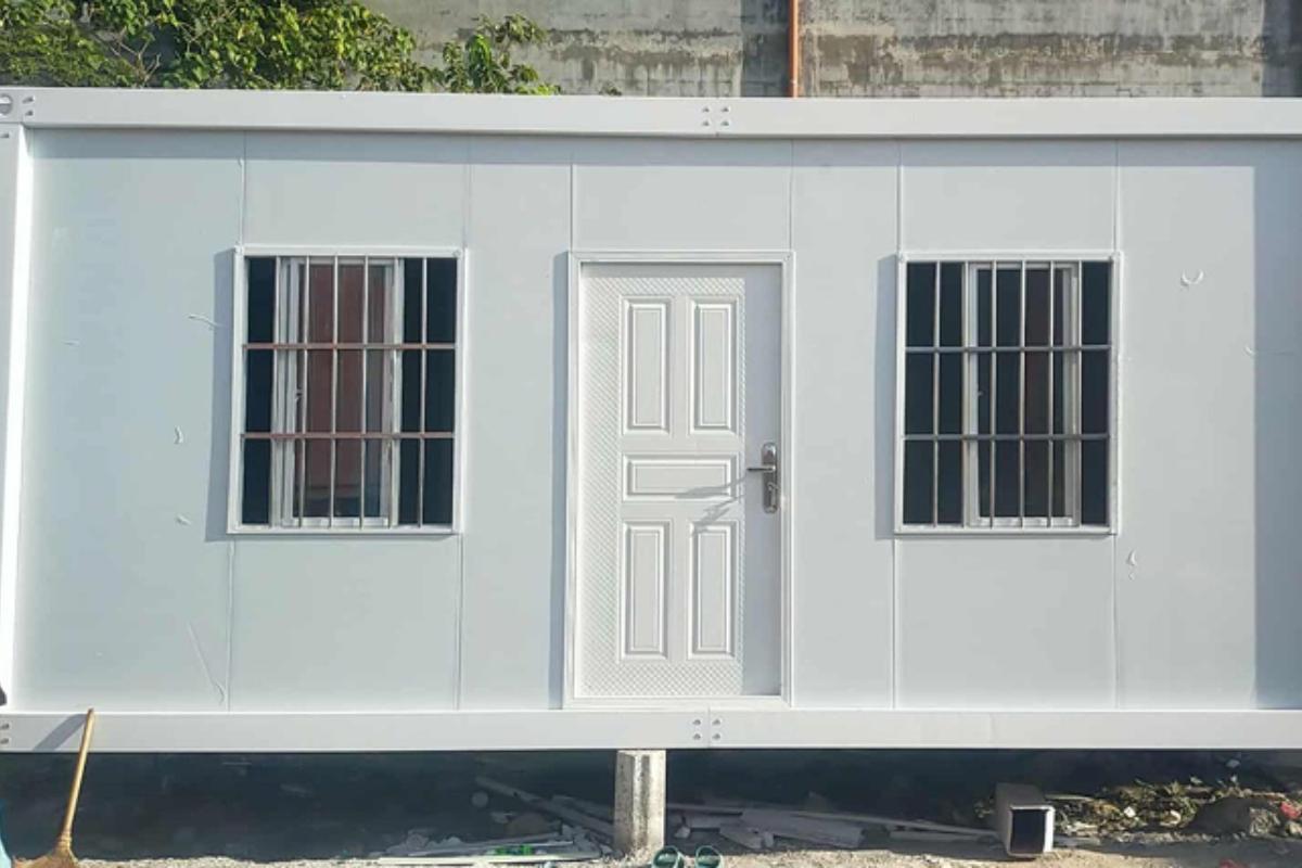 Single prefab container site office with barred windows and door