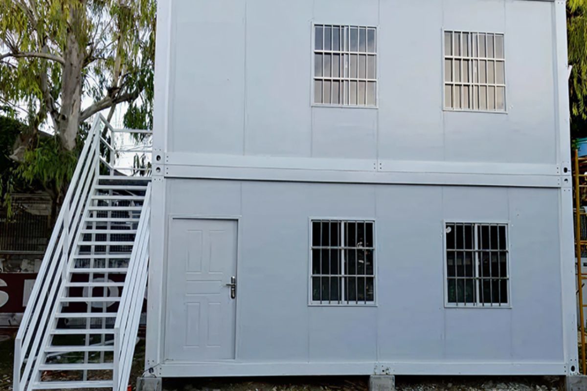 Two-story prefab container site office with exterior staircase