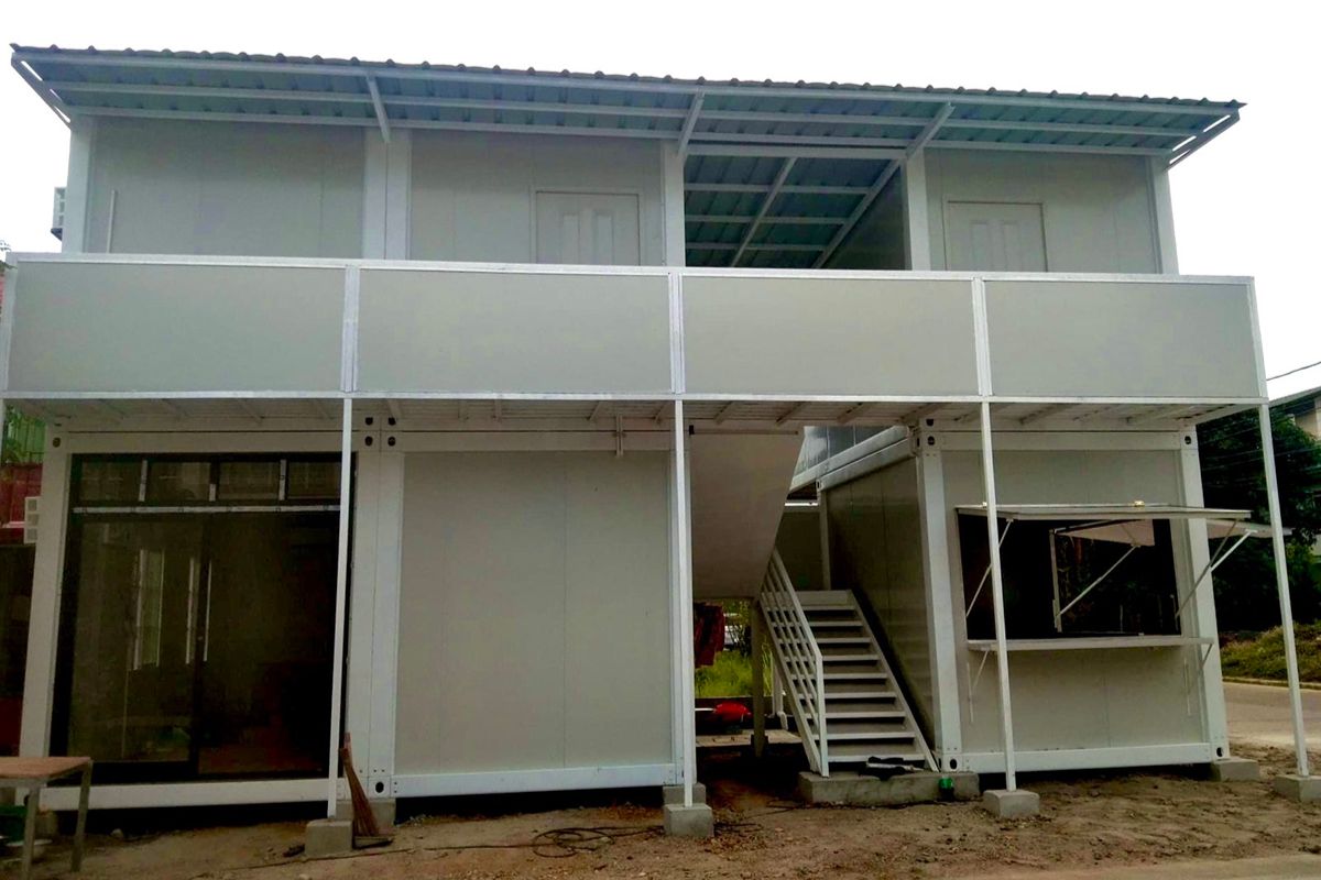 Two-story modular prefab container building configured for expanded worksite facilities
