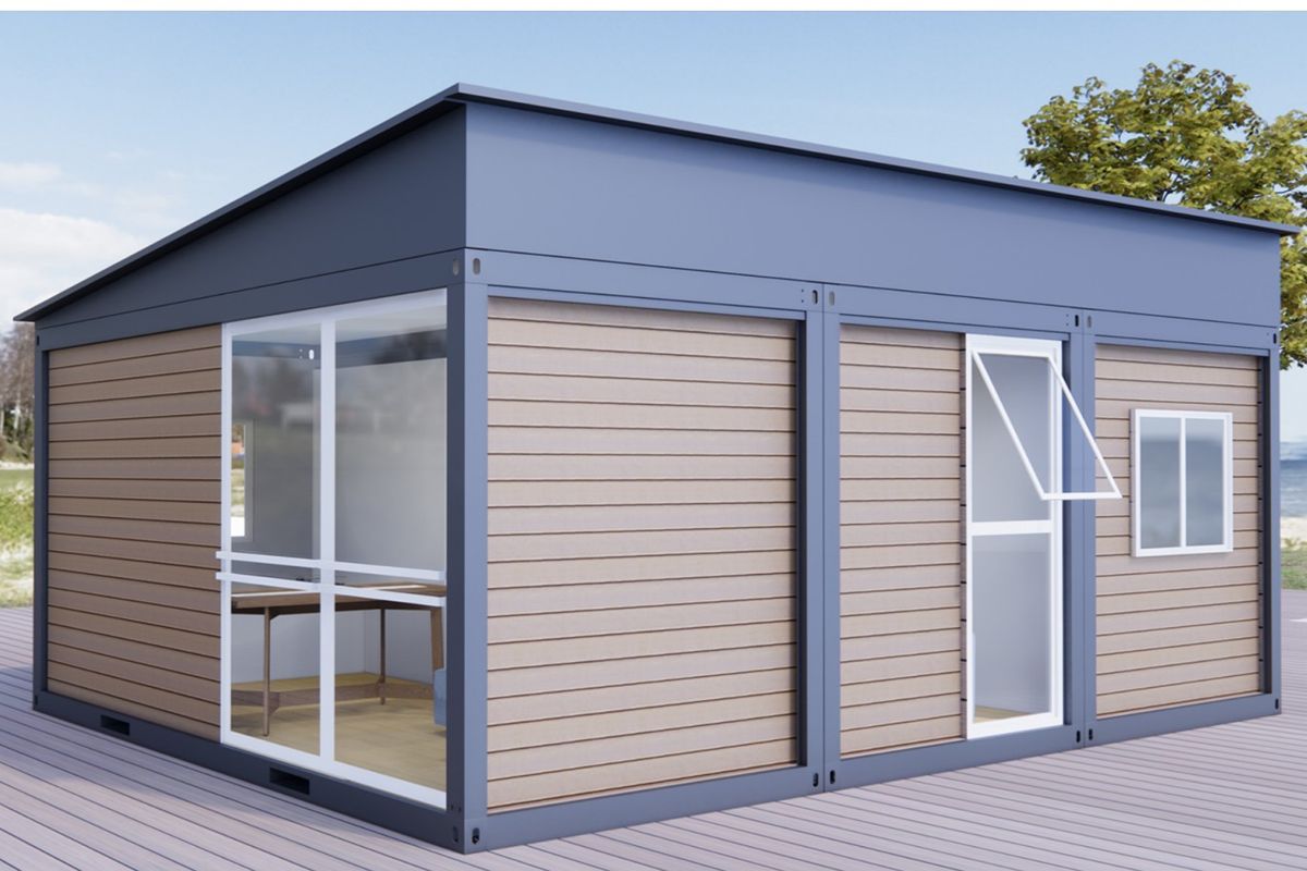Modern prefab container building with wood-style exterior panels, large windows, and a compact modular design